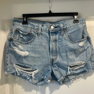 Levi’s 501 high waisted light/medium wash distressed jean shorts